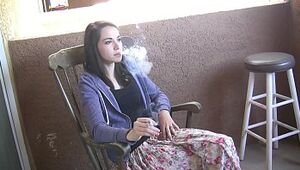 Emily Grey warm nubile woman smoking a ciggie