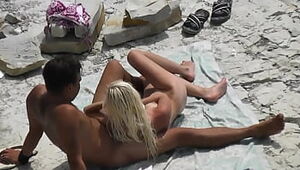 Spycam Slender light-haired Strokes and her bf at beach
